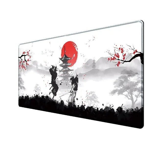 Japanese samurai design gaming mouse pad with cloth surface on a desk.