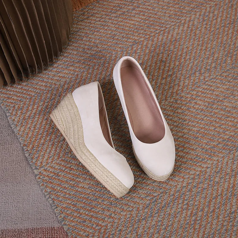 Women's apricot wedge heel pumps with rope-textured sole and shallow mouth opening on a white background.