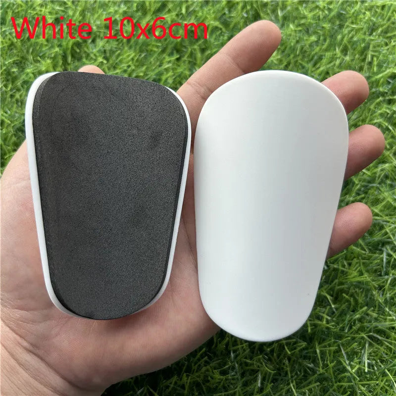 Extra small plastic football shin guards in black or white colour options