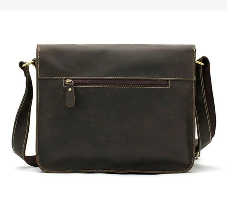 Vintage brown leather messenger bag with antique brass buckle and crossbody strap