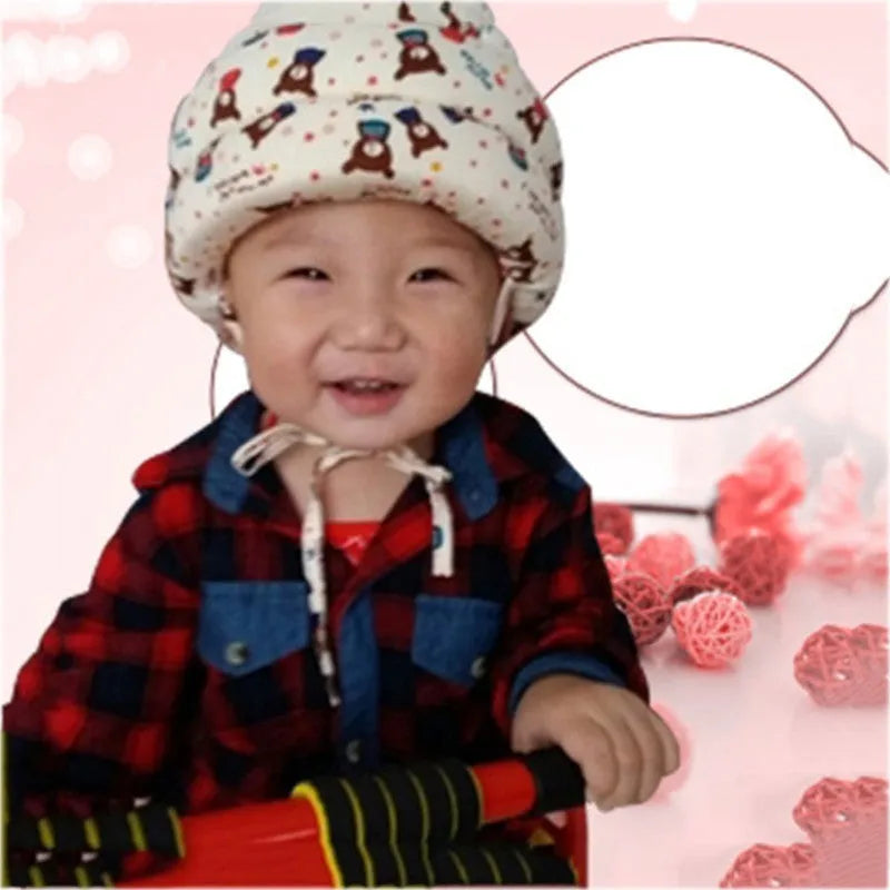 Baby anti collision hat with high-density sponge padding, adjustable headband, breathable cotton outer, colourful design