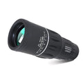 Black 16x52 monocular telescope showing eyepiece and objective lens, placed on a surface.
