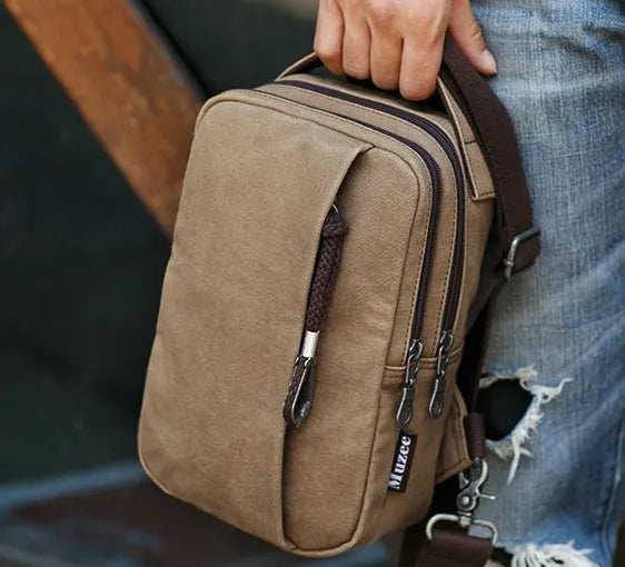 Canvas cross body bag in light brown with adjustable shoulder strap, 16x10x25 cm dimensions