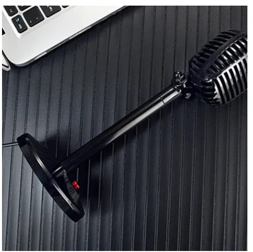 Black USB computer microphone with adjustable stand on weighted base for podcasting and voice recording