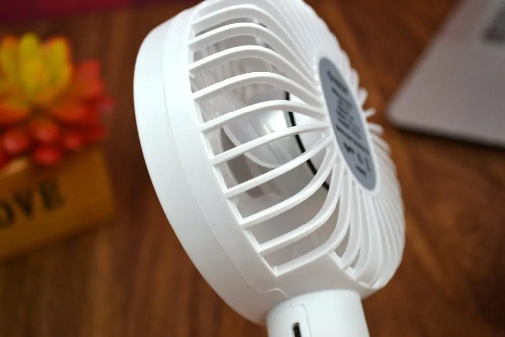 ORICO FH1 white portable USB rechargeable fan with adjustable speed settings and handheld design