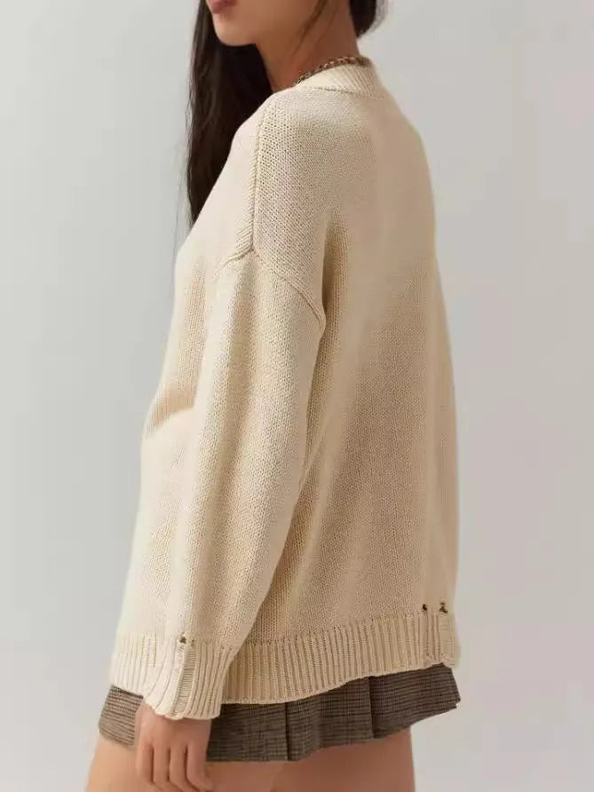 Women's loose-fit acrylic jacquard knit sweater with round neck and long sleeves in milky white