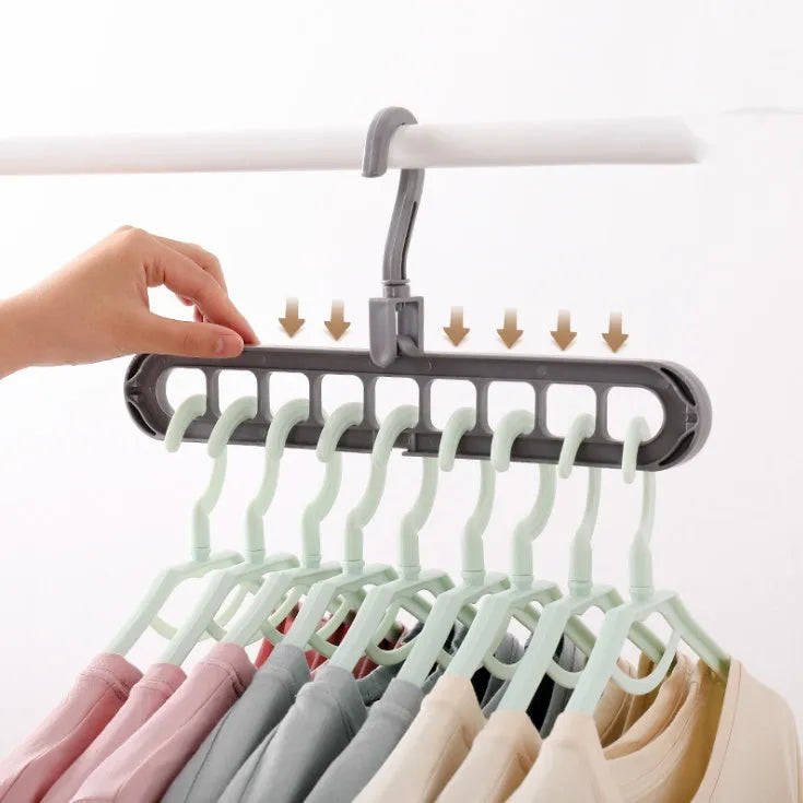 Plastic clothes hanger with rotating hook in pink colour