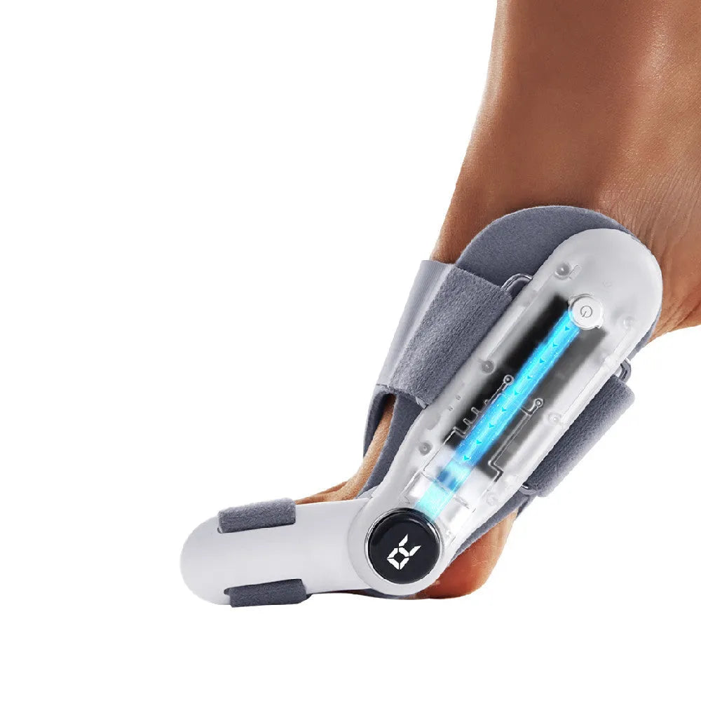 White plastic electric hallux valgus toe separator with USB Type-C charging cable.