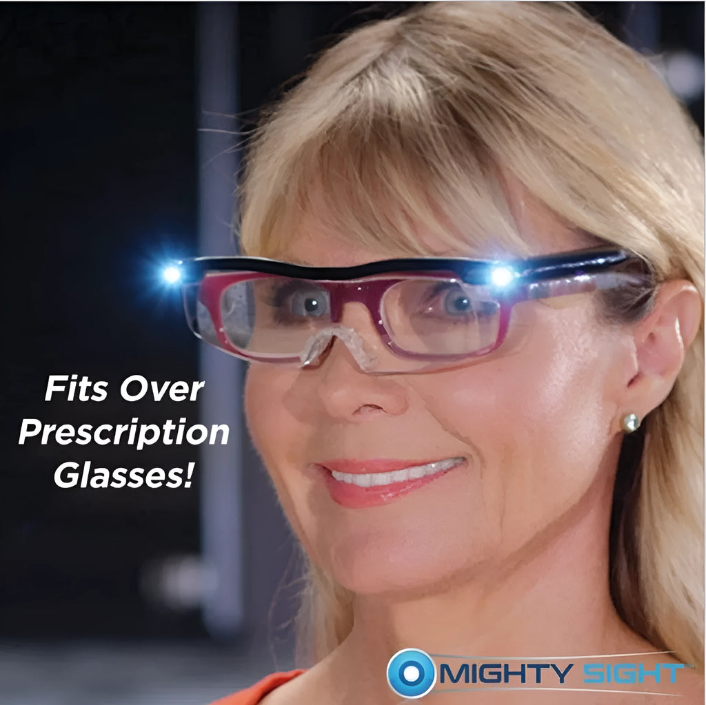 Transparent black USB LED light reading glasses with scheduled timer feature on a desk.