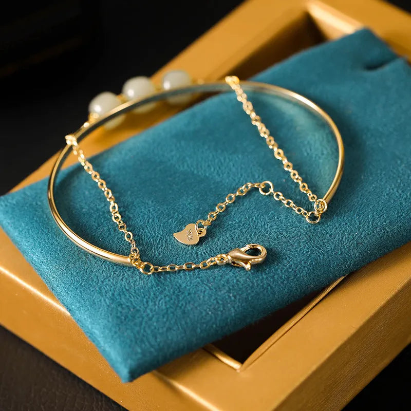 Women's jade lucky beads bracelet with gold inlay decoration in single, double and three beads versions