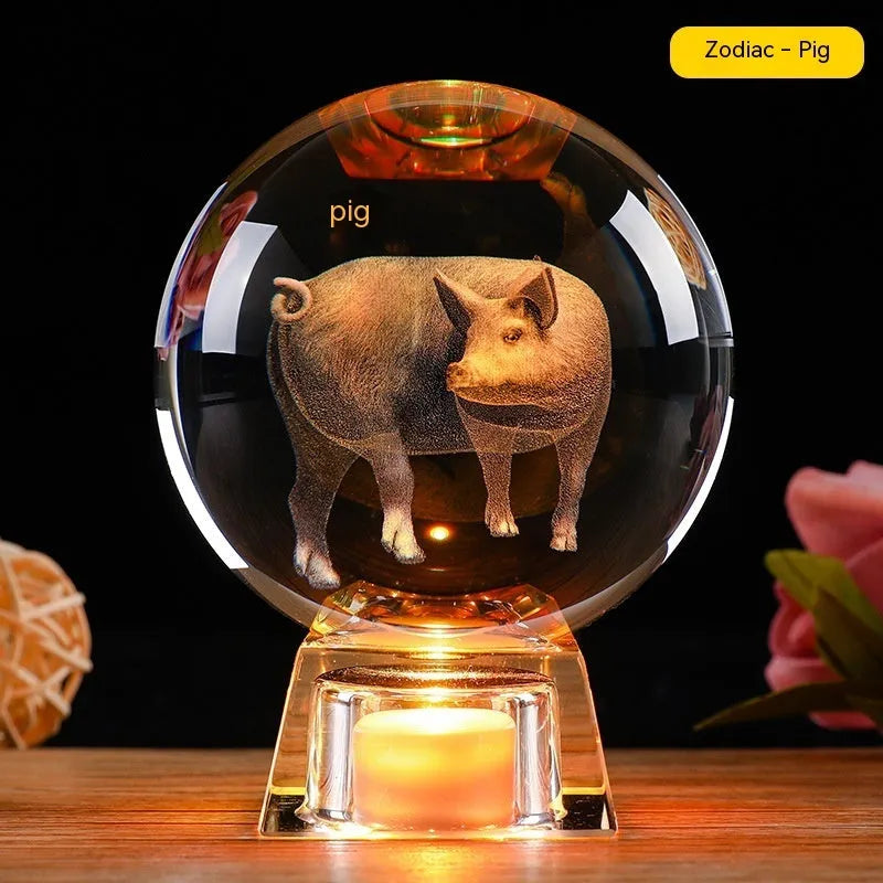 White crystal ball luminous ornament with Chinese zodiac animal design on an electronic charging base.