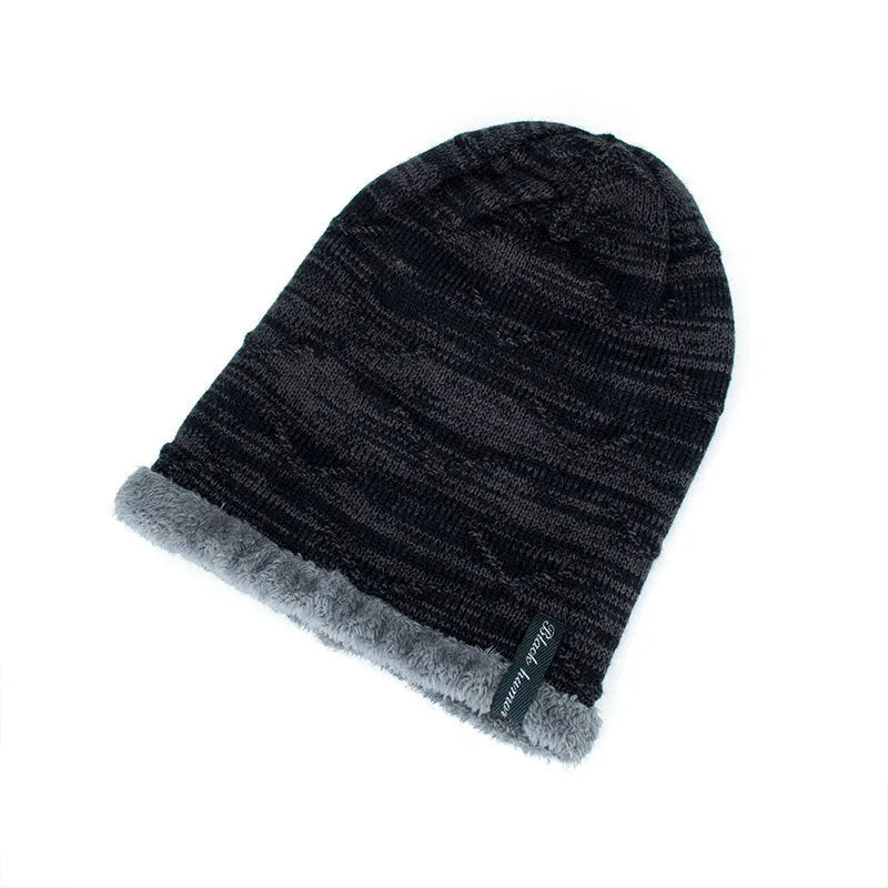 Diagonal hook knitted acrylic beanie in black, showing textured knit pattern