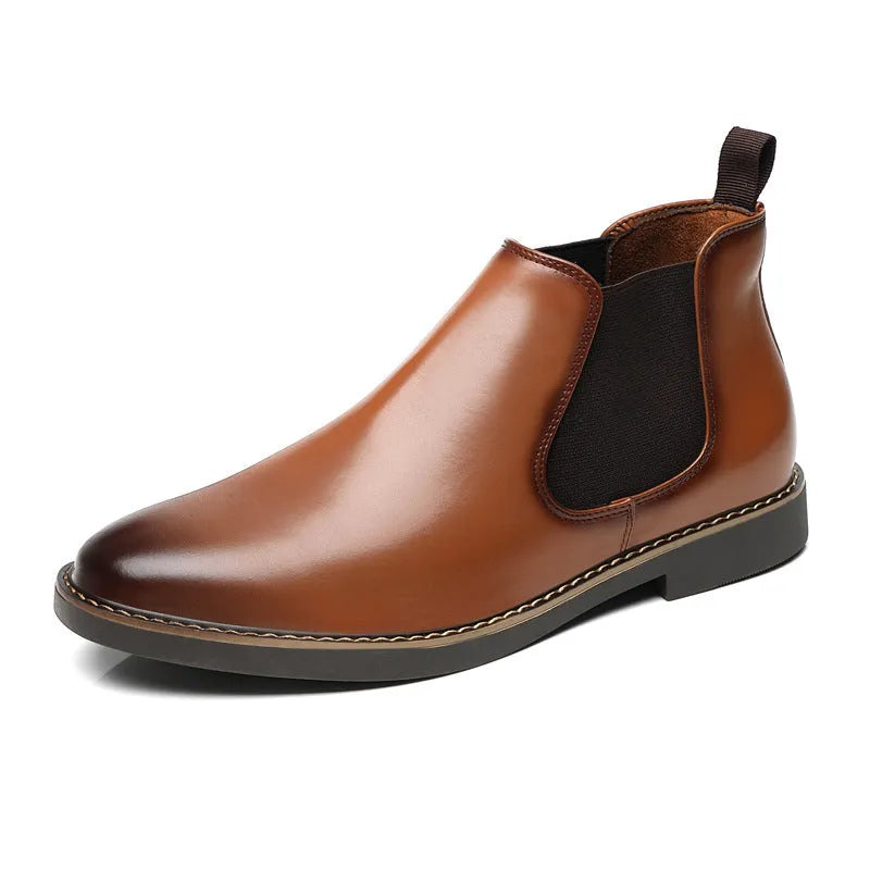 Black formal pointed-toe leather boots with a square heel and rubber sole on a neutral background.
