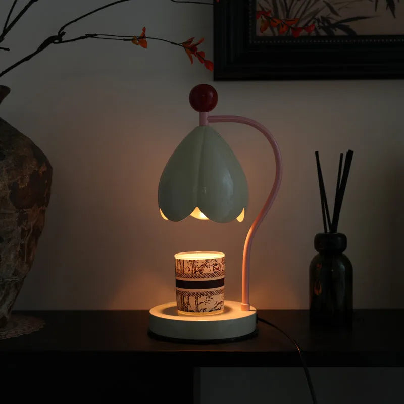 Linglan modern style melting wax fragrance lamp with metal holder on a desk.