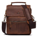 Men's brown leather shoulder bag with zipper buckle closure on soft surface