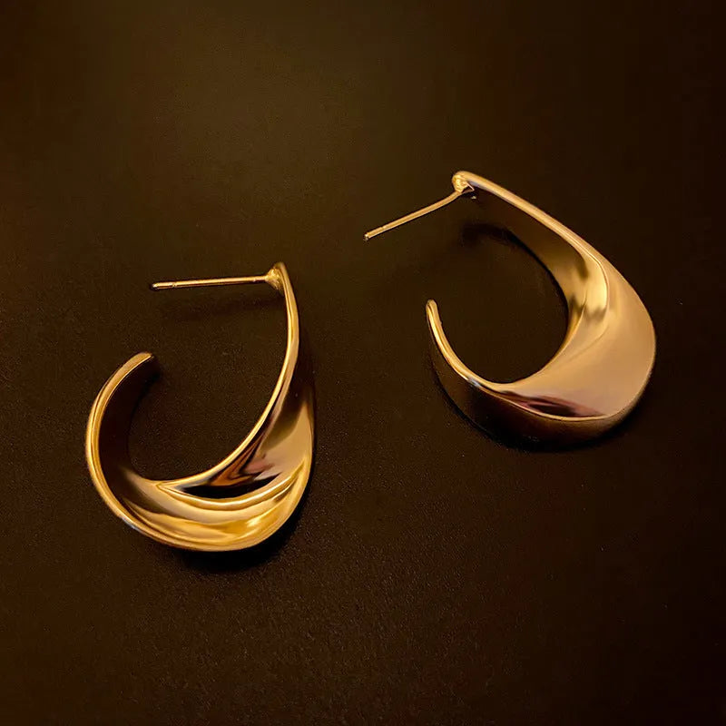 Metal geometric earrings with twisted design in gold or silver electroplated finish
