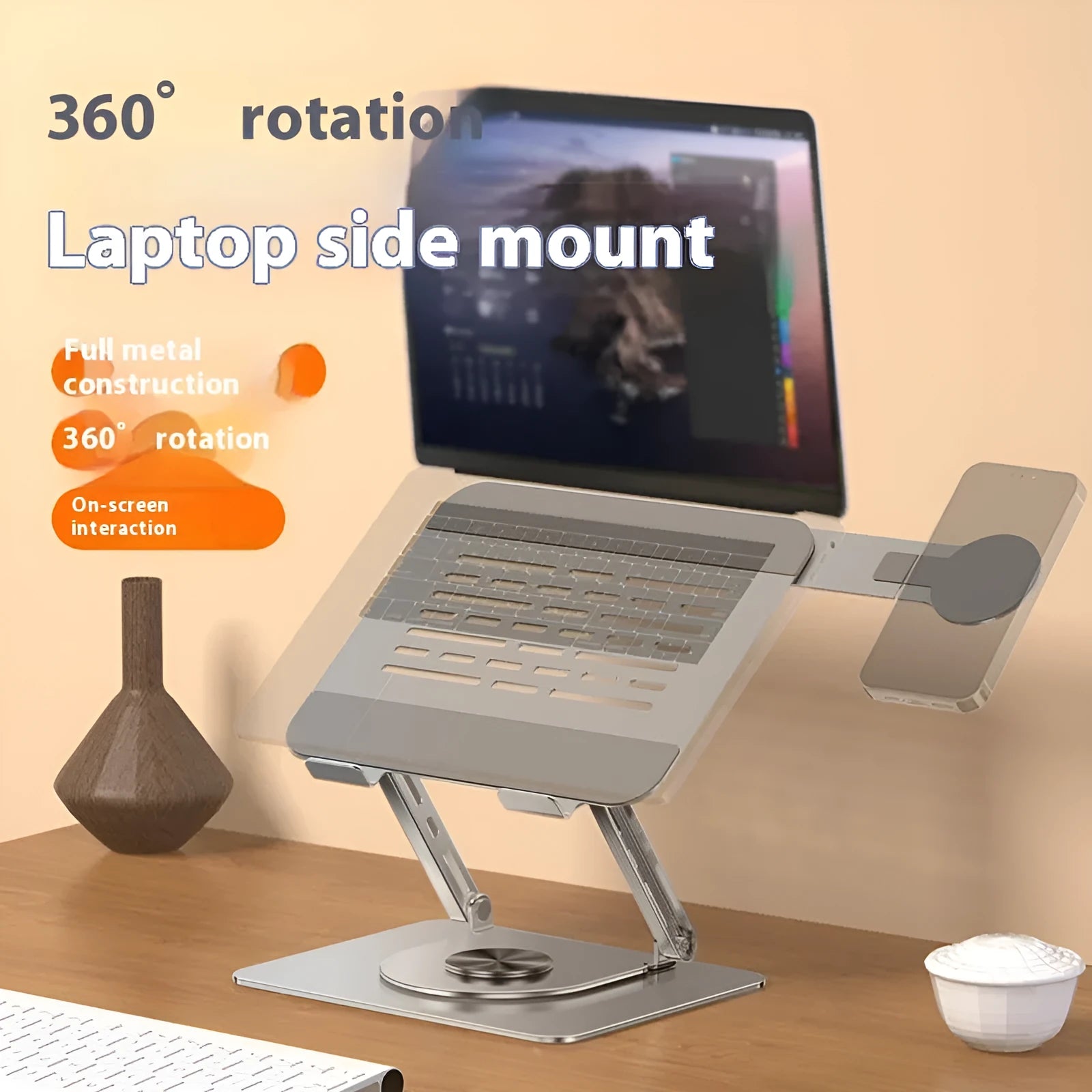 Silver carbon steel laptop stand with a side-mounted magnetic mobile phone holder on a desk