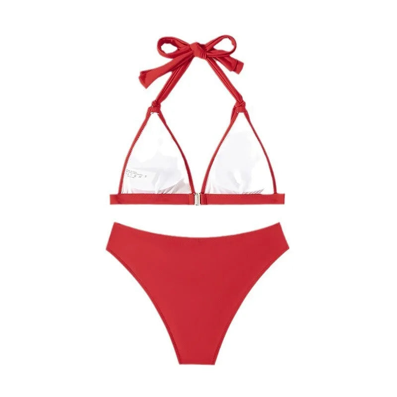 Red women's lace-up halterneck bikini set with split beach design for swimming