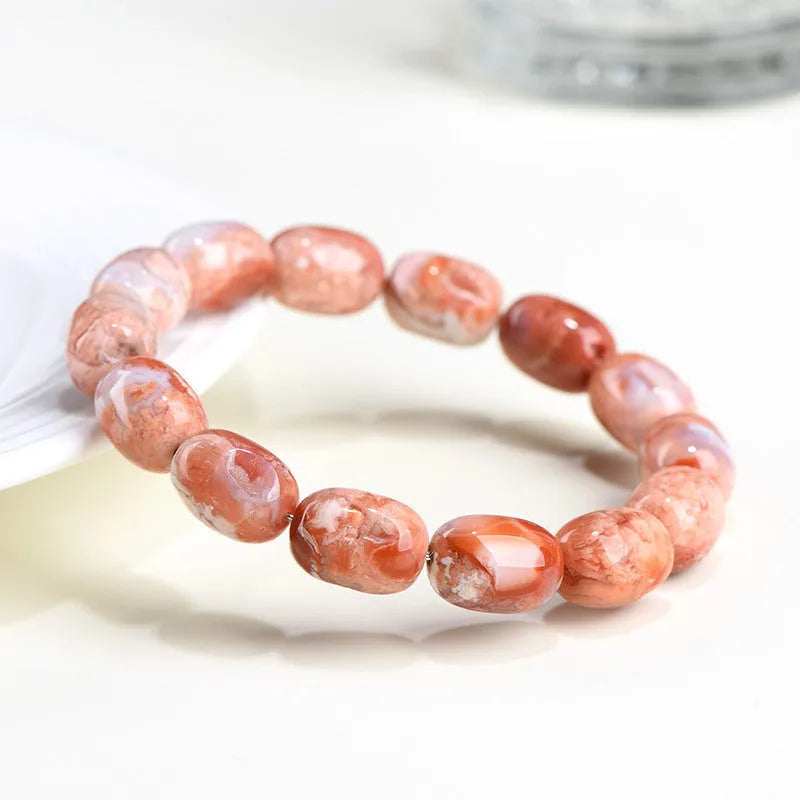 Natural cherry agate bracelet with barrel shaped beads and carved Ruyi symbols