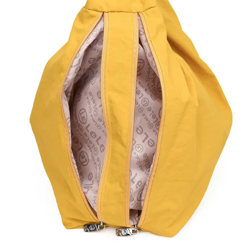 Women's heart-shaped nylon underarm bag in black, yellow, khaki, and blue colour options showing large capacity design