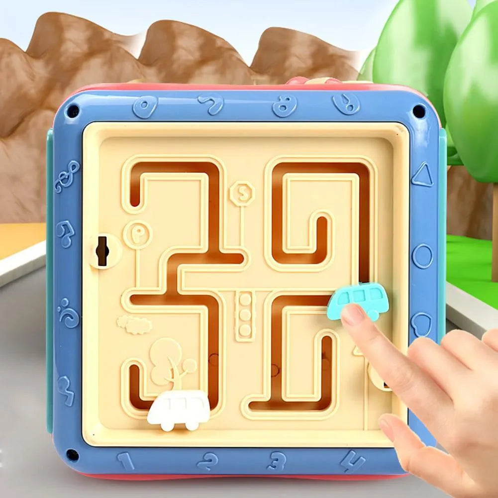Multicoloured baby hexahedron educational toy cube showing bead maze, gear, and car maze activity faces