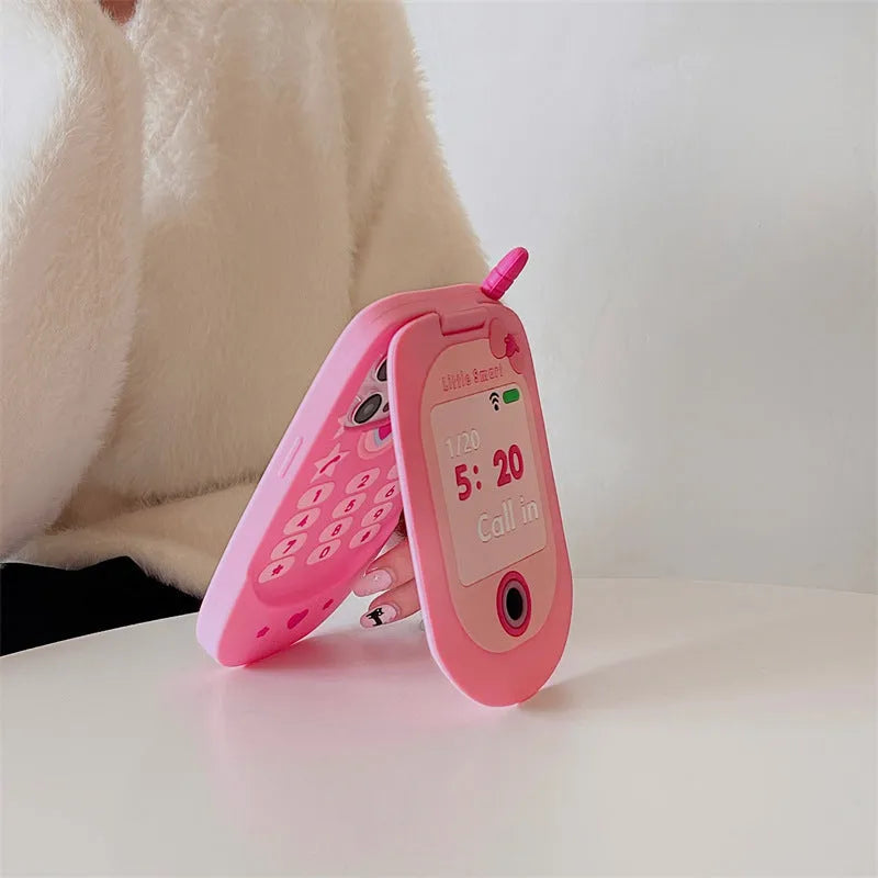 Light pink silicone flip phone shape mirror case for iPhone showing built-in mirror and nostalgic design