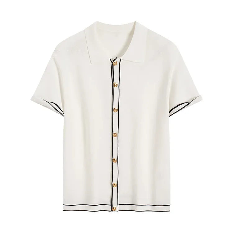 White short sleeve cardigan with dark contrast lapels on a hanger.