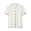 White short sleeve cardigan with dark contrast lapels on a hanger.