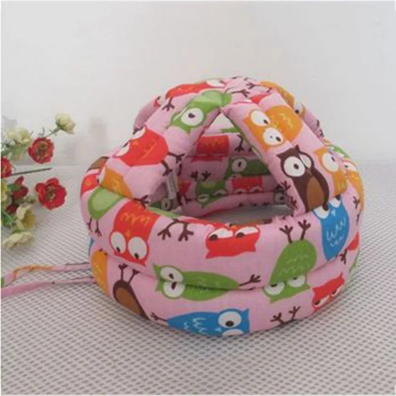 Baby anti collision hat with high-density sponge padding, adjustable headband, breathable cotton outer, colourful design
