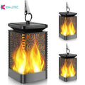 Set of four black solar-powered LED lanterns with flame flicker effect for outdoor garden use.
