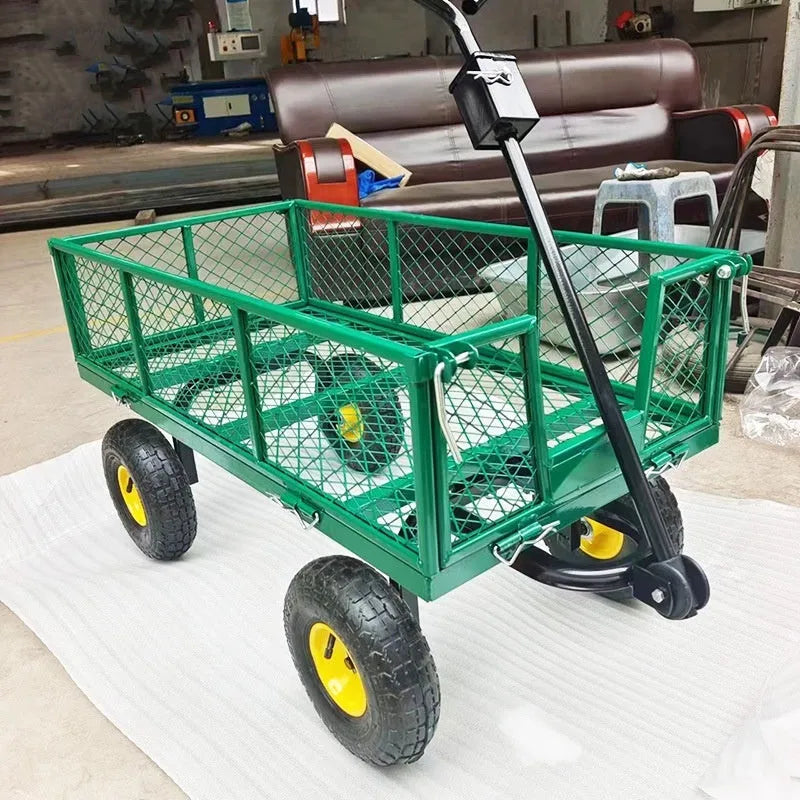 Green four-wheel hand push net cart with iron frame and rubber wheels on outdoor ground