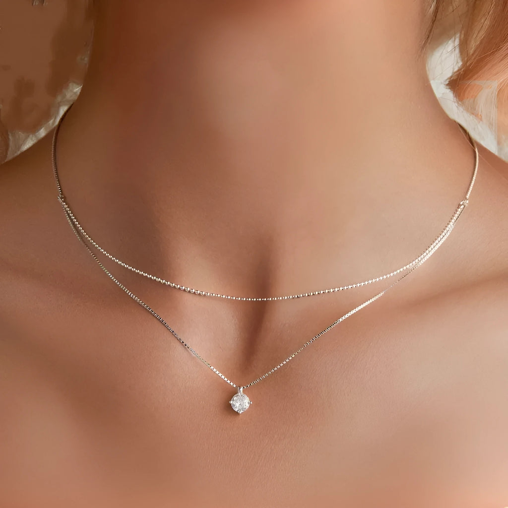 Women's sterling silver double-layer necklace with pearl chain and contemporary pendant