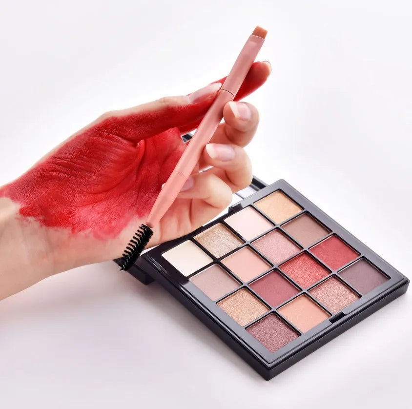 Open case showing 10 pink-handled makeup brushes including loose powder, foundation, flat head, and double-ended brushes.