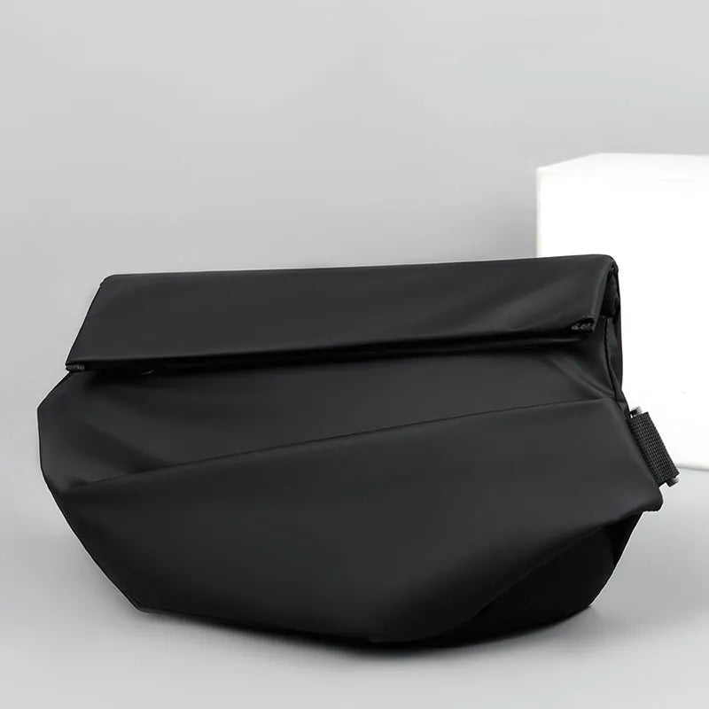 Grey PU leather crossbody sling backpack for men showing horizontal square shape and shoulder strap