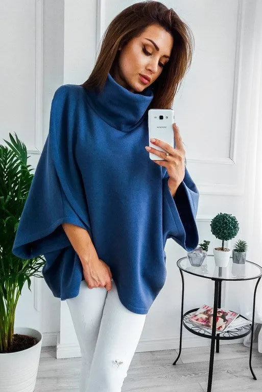 Long grey women's cardigan with batwing sleeves and three-button placket laid flat