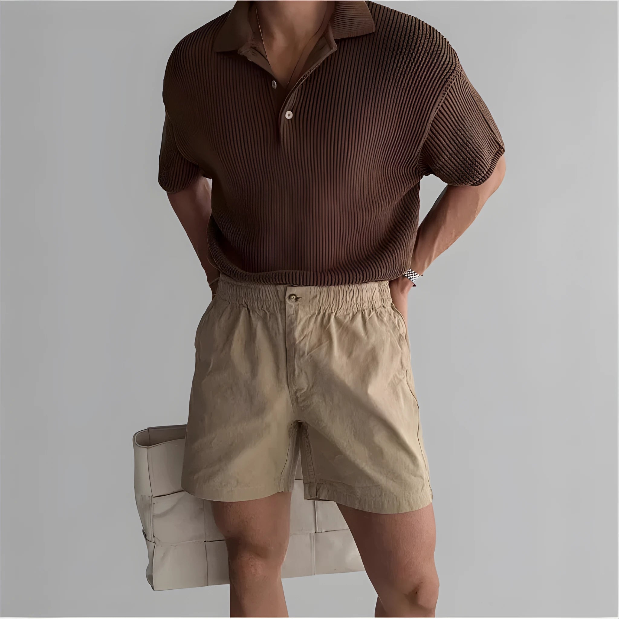 Cotton loose-fit sports shorts in black, shown on a model, suitable for summer activities.