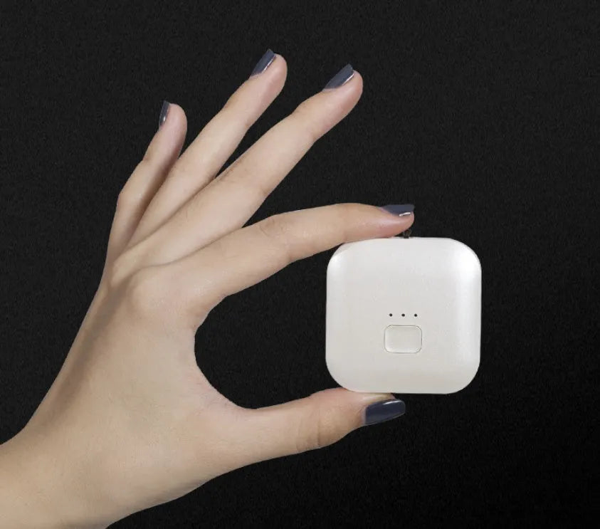 Mini USB portable air purifier necklace in collar design shown in blue, grey, pink and white colours.