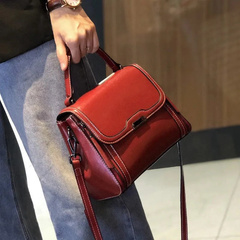 Women's genuine leather messenger bag in horizontal square design with multiple internal compartments