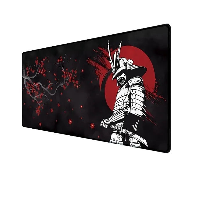 Japanese samurai design gaming mouse pad with cloth surface on a desk.