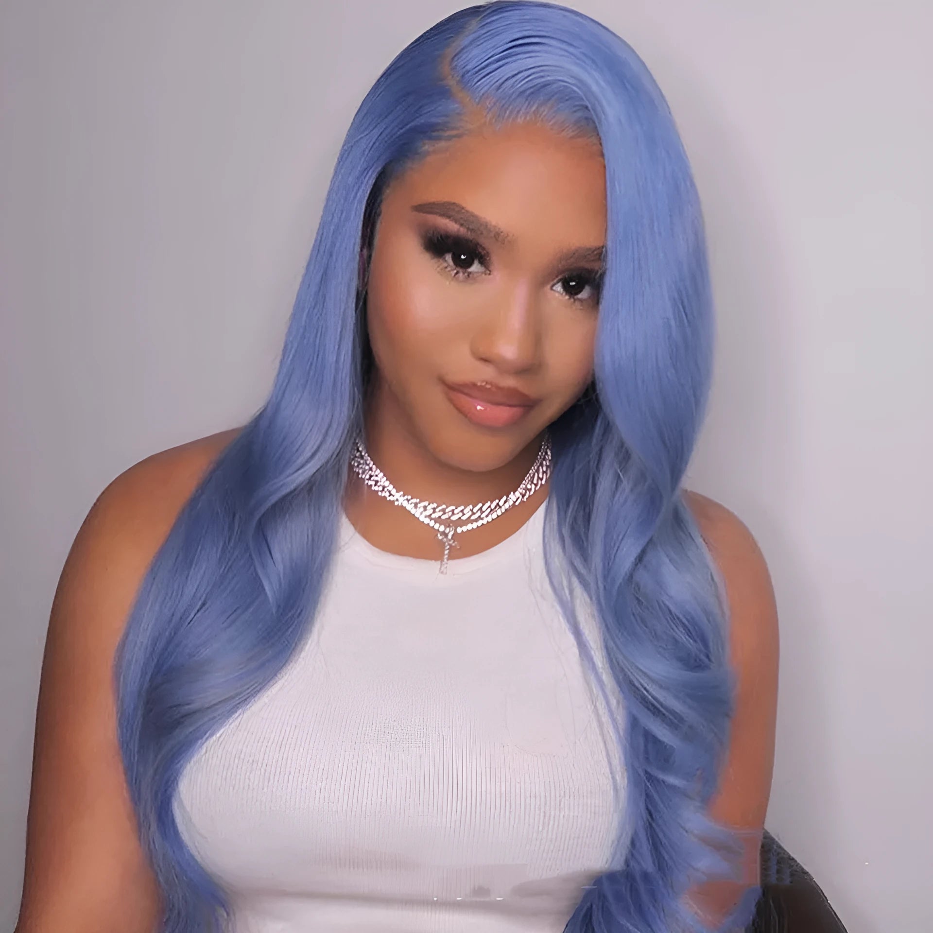 Body wave human hair lace front wig in real hair shown with straight bangs.