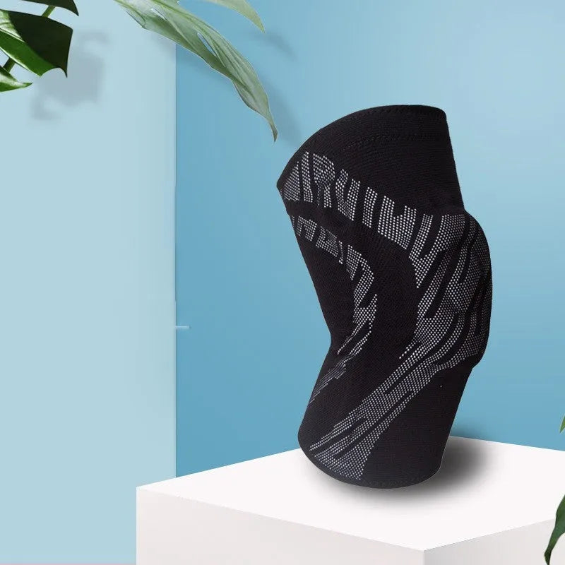 Pair of black pressurised nylon basketball knee pads for men, shown laid flat.