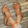 Slope heel roman style slippers with fish mouth toe holder in various colours on a rubber sole.