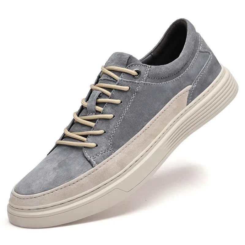 Men's grey low-top casual skate shoes with pigskin upper and rubber sole, shown from the side.