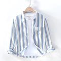 Men's blue long sleeve Hong Kong style loose fit shirt on a hanger.