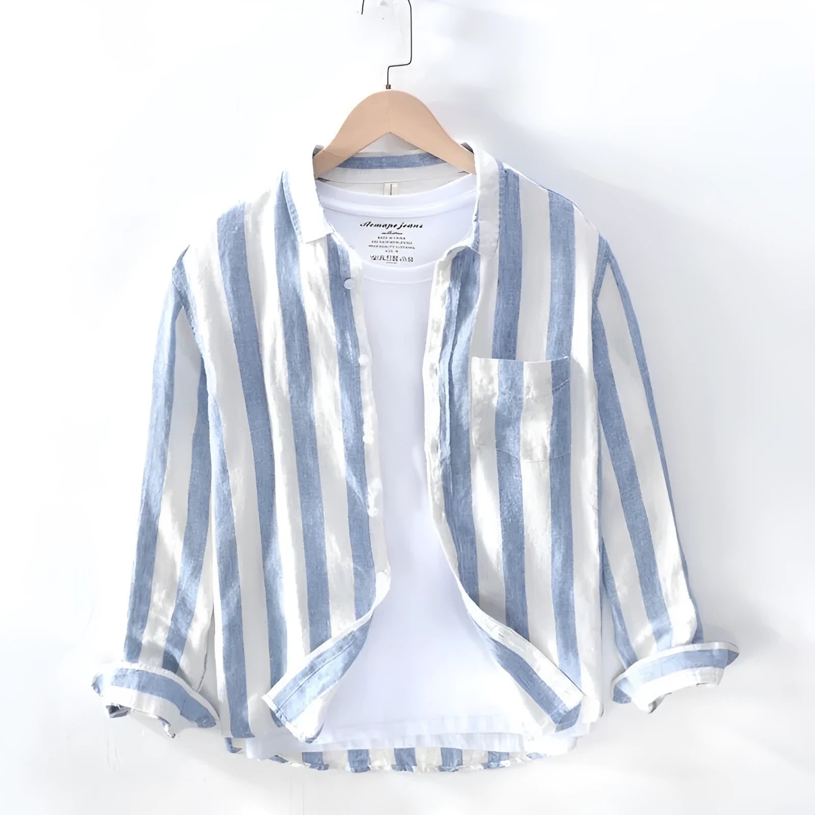 Men's blue long sleeve Hong Kong style loose fit shirt on a hanger.