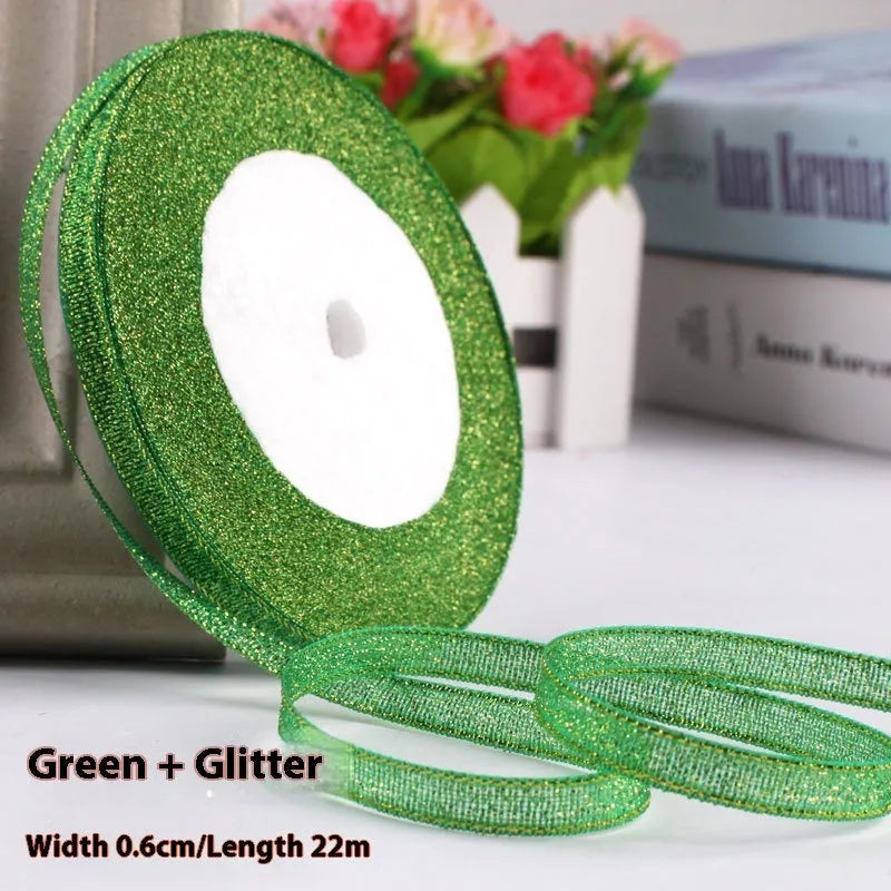 Roll of narrow 0.6cm wide polyester decorative ribbon in multiple colour options including metallic finishes