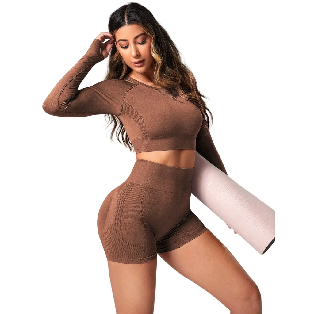 Women's black yoga suit with high waist pants and long sleeve pullover top for yoga practice