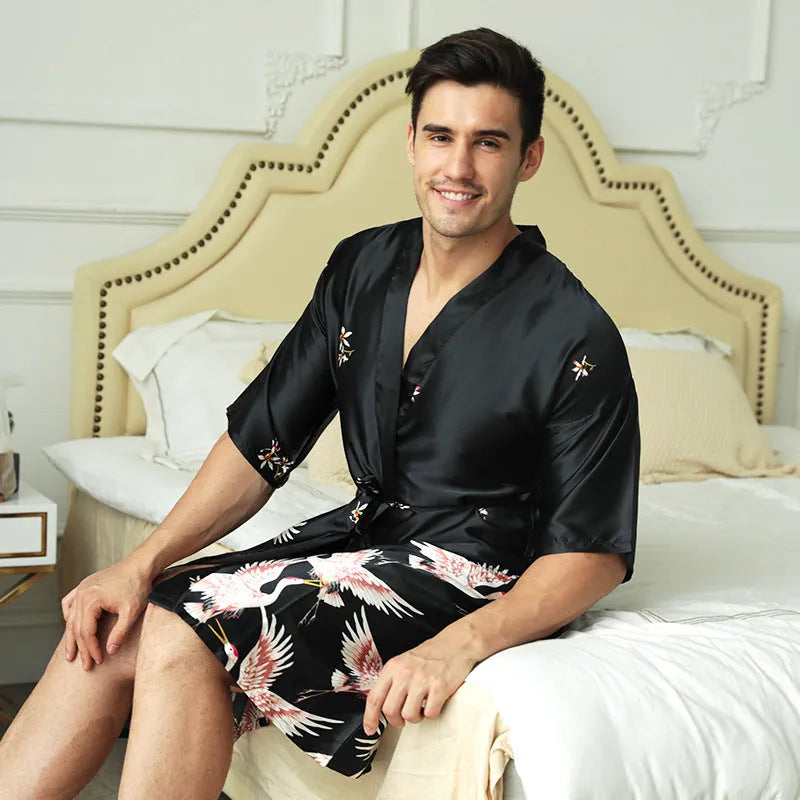 Mid-length printed artificial silk men's nightgown in cardigan style, black colour, on a hanger