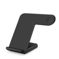 Black Qi wireless charging pad with phone on top and USB-C cable.