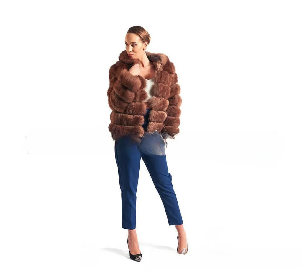 Women's loose fit hooded faux fur coat in brown on a model, showing medium length and street fashion style.